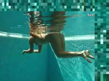 Russian girl in her bikini has fun stripping and swimming