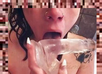 Gagging on clear dildo in shower