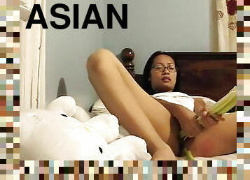 Spicy Asian chick in glasses is masturbating