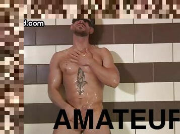 Masked tattooed muscle guy jerks off and cums in the shower