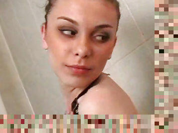 Astounding teen posing nude and wet