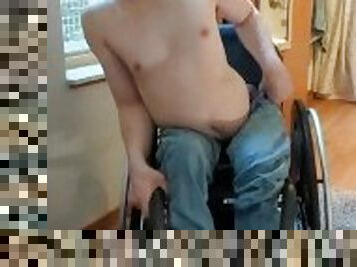 Paraplegic strips in his wheelchair