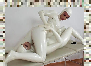 Agate and Tanja are dressed in pretty white latex