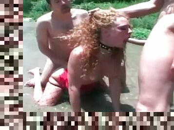 Anal threesome in a river with redhead