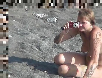 MILF nudist is getting naked on the beach