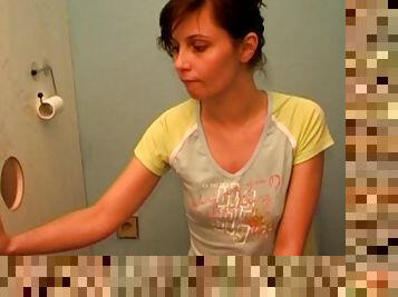 Short-haired brunette suck a dick in the toilet
