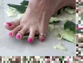 Cucumbers crush under my toes