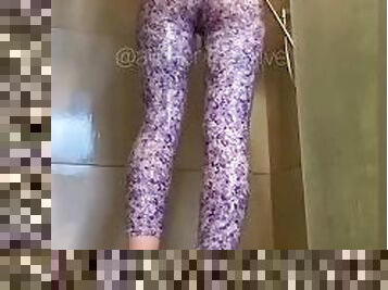 Girl showers in tight floral leggings