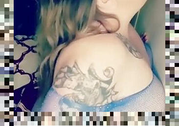 BBW in blue fishnets sucking on a dildo