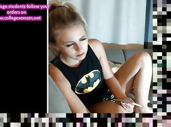 Batgirl strips fingers & sucks dick on cam