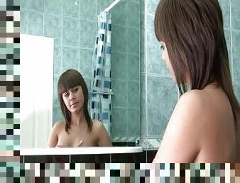 Naked 18yo beauty takes a sexy shower with fingering