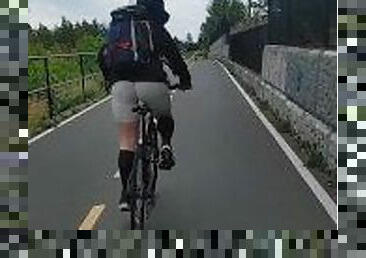 Hot ass woman biking in skin tights on public trail