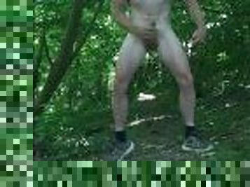 Muscle stud exhibitionist walking and jerking off naked in the woods near a road.