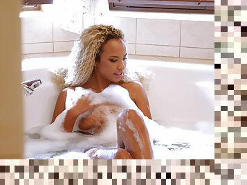 Curly ebony beauty soaps her body then gets working with a white dong