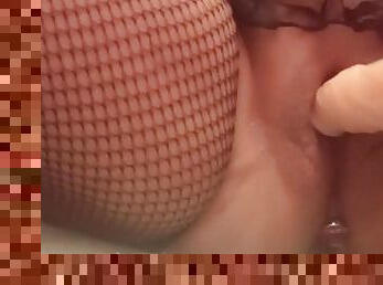 Fishnet stockings, masturbating with a dildo, big pussy