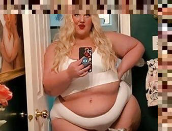 The chubby princess talks and shows her soft and fat body in the bathroom mirror.