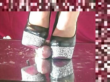 Mistress elle with her shiny heels breaks her slave's cock